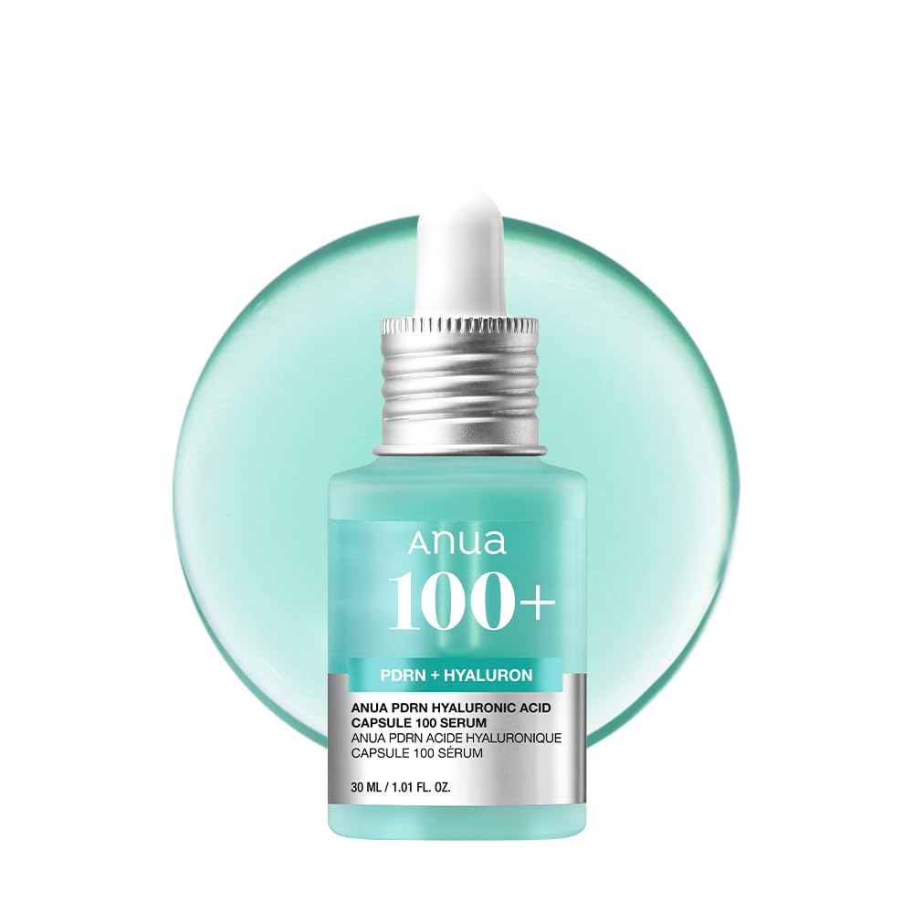 Anua 100+ serum bottle with dropper on a light blue background