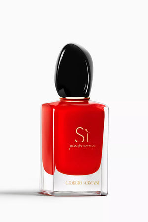 Red perfume bottle with black cap on a white background