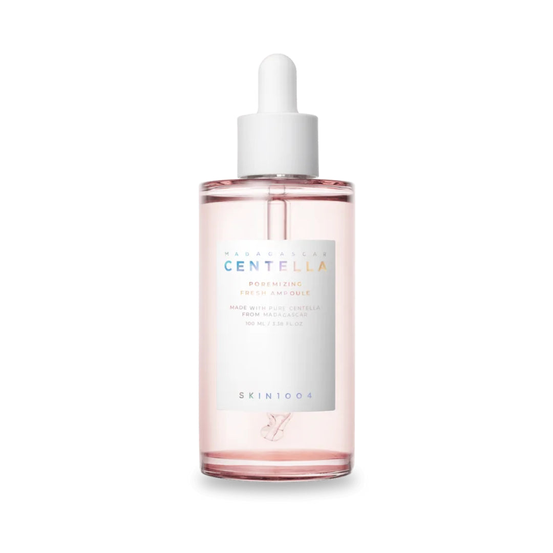 Skincare dropper bottle with pink liquid on a white background